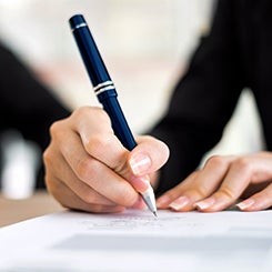 Hands with pen